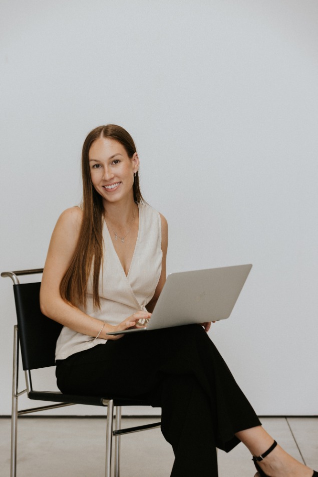 Smiling white female marketing professional with long brown hair